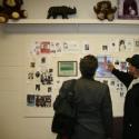 Ray Cook tells the story of those whose pictures at on the obituary wall at the after school program "On Our Shoulders."  Episode 12.