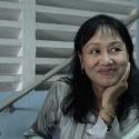 Name TK, who runs a theater school and company in Saigon.  During the war, she was a student activist fighting for peace.